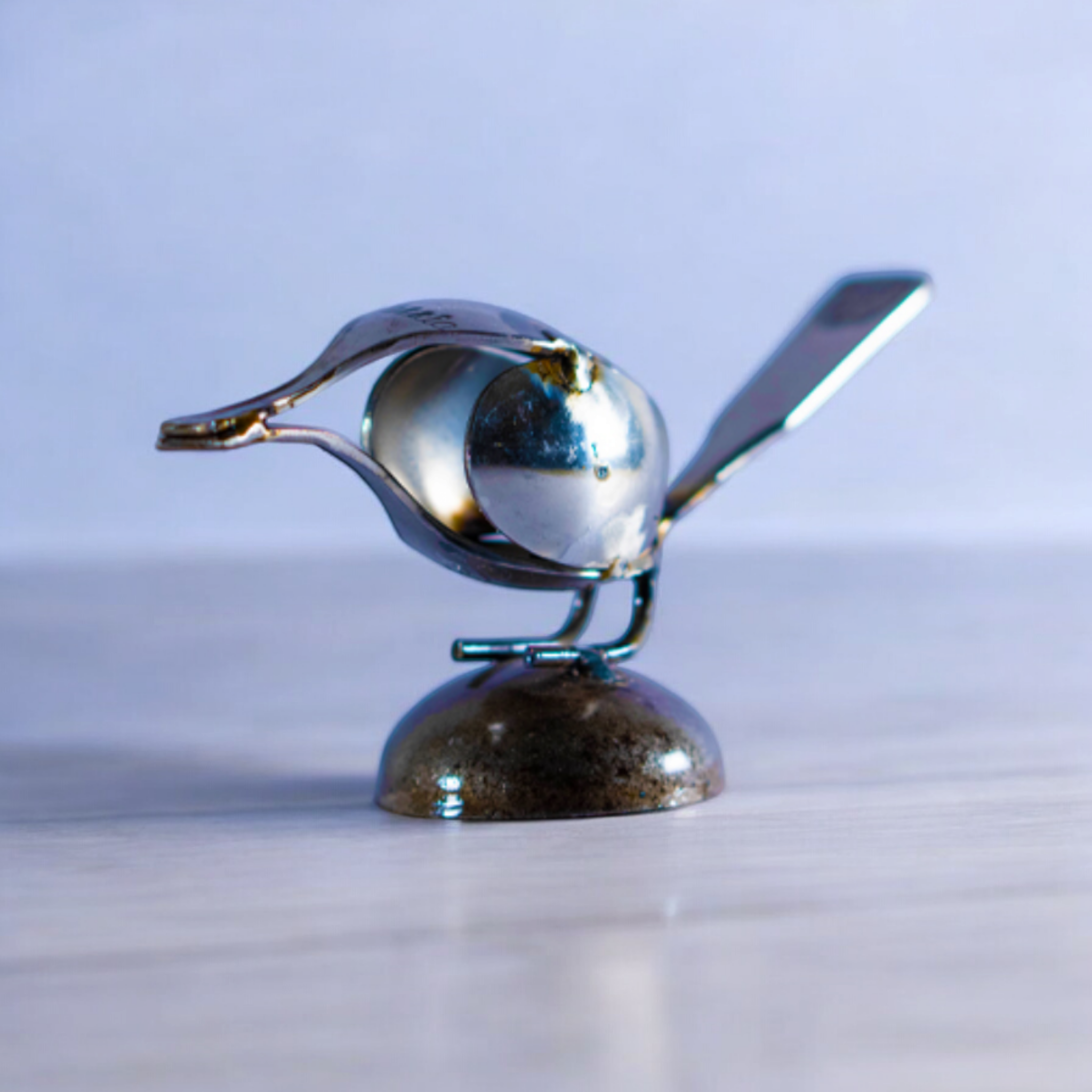 Bent Spoon Bird Inspired Recycled Metal Sculpture With Round base